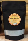Black stands up pouch that has within it a branded drink mix called Blue Potion with Berries Lemon Honey and Blue Spirulina powdered drink mix